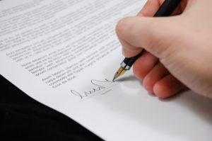 A person signing a Employment contract in australia