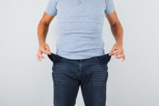 startup a man showign empty pockets